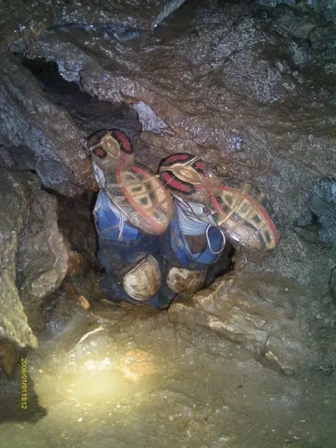 The HAUNTING image of John Jones stuck upside down (70 degree angle) inside the Nutty Putty Cave.